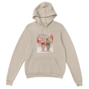 May include: Beige hoodie featuring a watercolor illustration of two cats in traditional Japanese attire, walking under umbrellas. The artwork includes red and white accents, with a pocket at the front and a hood.