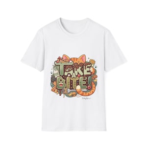May include: A white short-sleeve t-shirt featuring a colorful graphic print with the text "TAKE A BITE!" in large green letters. The design includes an orange tabby cat, a bottle of catnip tea, pizza, pasta, fries, and various sweet treats.