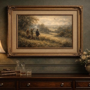 May include: An ornate, framed landscape painting depicting three figures hunting in a field. The painting is set in a gold frame and hangs above a dark wood dresser. A lamp, books, decanters, and a floral arrangement complete the scene.