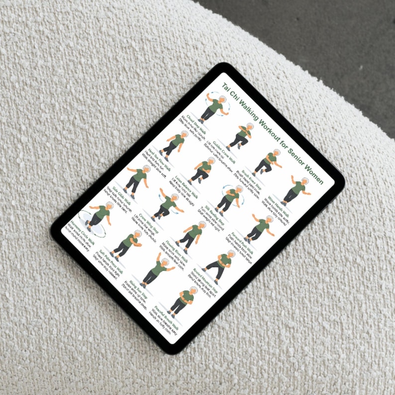 May include: A black tablet displaying a Tai Chi walking workout for senior women. The screen shows illustrated figures demonstrating various Tai Chi movements. The tablet is resting on a textured, off-white surface.