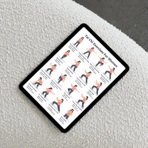 May include: A black tablet displays a guide titled "Tai Chi Exercises For Women." The guide features illustrated figures demonstrating various Tai Chi movements. The tablet is set against a textured, off-white surface.
