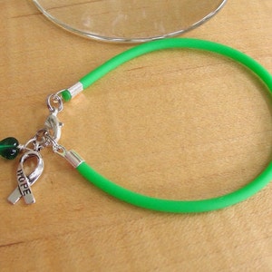 Green Awareness Bracelet Rubber Cerebral Palsy, Glaucoma, Kidney Disease, Liver Cancer, Organ Donation, Mitochondrial Disease, HPV image 4