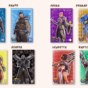 May include: A collection of eight rectangular character cards featuring Overwatch figures: Soldier 76, Hanzo, Moira, Pharah, Junkrat, Reaper, Vendetta, and Baptiste. Each card displays a unique background color, character illustration, and role icon.