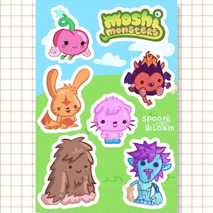 Puede incluir: Una hoja de pegatinas con monstruos de dibujos animados coloridos. La hoja incluye una criatura rosa con forma de cereza, un conejo naranja, un gato morado, un monstruo marrón y peludo, un monstruo murciélago de fuego y un personaje azul con aspecto de zombi. El texto "moshi monsters" es visible.