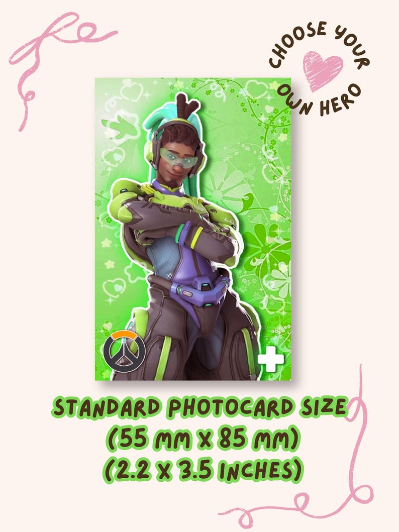 May include: A rectangular trading card featuring a character in a green and purple futuristic suit with headphones, set against a green floral background. The text CHOOSE YOUR OWN HERO and a heart are visible. Dimensions are 2.2 inches by 3.5 inches.