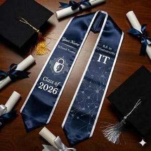 May include: Navy blue graduation sash with white text and graphics. The sash reads "Your Name," "School Name," "Class of 2026," and "B.S. in Cybersecurity IT." The sash is surrounded by graduation caps and diplomas.