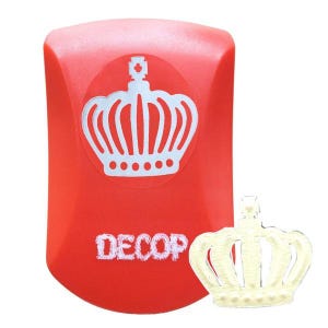 May include: A red rectangular stamp featuring a white crown design and the word "DECOP". A separate cream-coloured crown is also present. This stamp is likely used for crafting or scrapbooking projects.