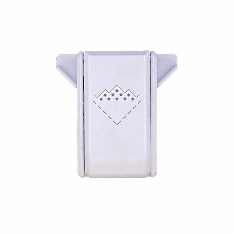 A white rectangular object with a diamond-shaped design on it.