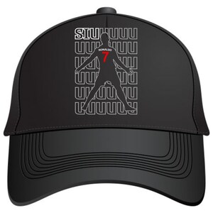 May include: Black baseball cap featuring a silhouette of a soccer player with the number 7 in red. The cap has the word "RONALDO" and the word "SIU" in white. The design is repeated vertically in a white font.