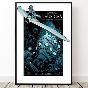 May include: Framed poster for "Nausica&auml; of the Valley of the Wind", featuring a character on a glider above a blue, glowing landscape. The poster includes the film title and "Studio Ghibli" text. The artwork is in a black frame.