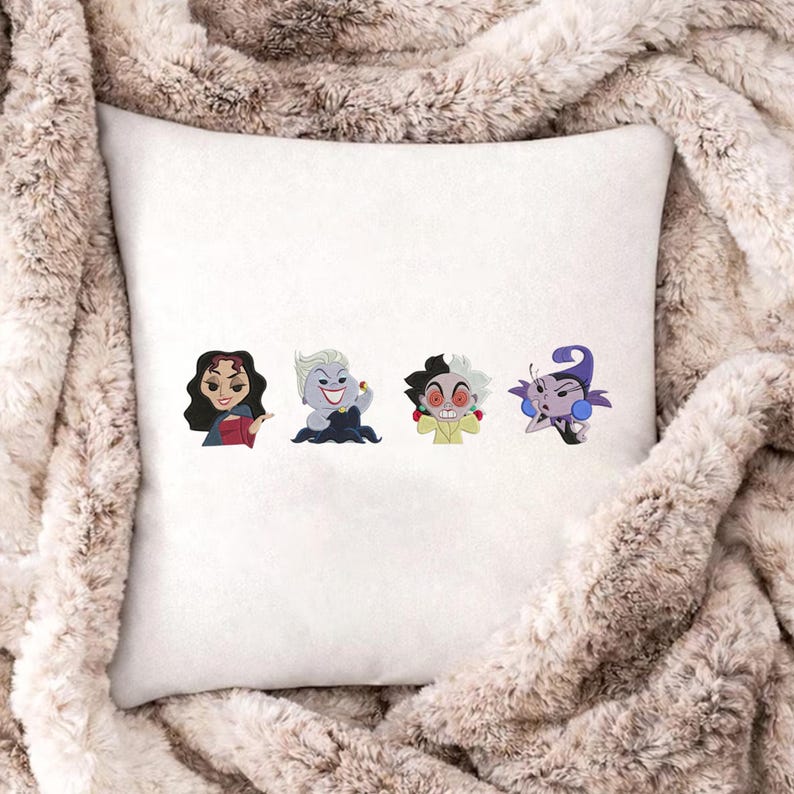 May include: White square pillow featuring four cartoon character designs. The characters are in a row and include a woman with dark hair, a woman with white hair, a character with black and white hair, and a purple character.