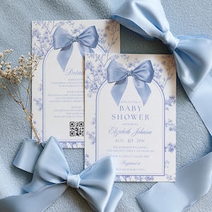 May include: Baby shower invitations with a light blue bow and floral design. The invitation includes the text "Join us for a Baby Shower" and details for Elizabeth Johnson's baby shower.