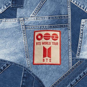 May include: A handmade, wooden serving tray with a natural finish. The tray features a rectangular shape with raised edges and two handles. The wood grain is visible, adding to its rustic charm. Dimensions are approximately 16 inches long and 10 inches wide.