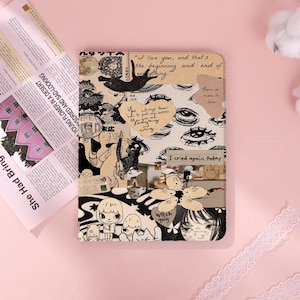 May include: A rectangular notebook featuring a collage cover with black and white illustrations of cats, eyes, and characters. Text includes "I love you, and that's the beginning and end of everything," "You always know how to push my buttons," and "I cried again today."