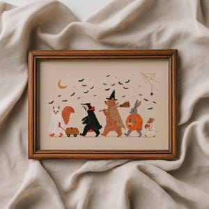 May include: A rectangular wooden frame containing an illustration of five woodland animals dressed in Halloween costumes. A squirrel as a ghost, a badger as a vampire, a bear as a witch, a rabbit as a pumpkin, and a mouse as a skeleton walk together.