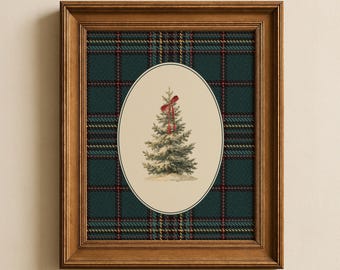 May include: A framed wall art piece featuring a central oval illustration of a green pine tree topped with a red ribbon bow. The background behind the oval is a dark green, blue, and red plaid pattern. The frame is made of brown wood.
