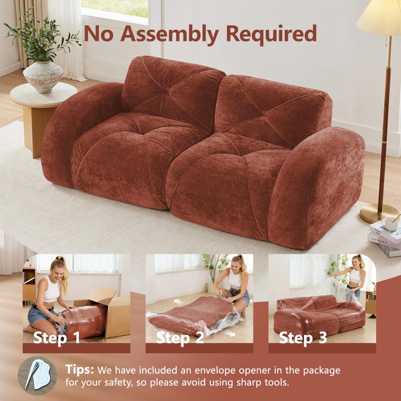 May include: A rust-colored, two-seater sofa with a textured, plush fabric. The sofa features a geometric quilted design on the back and seat cushions. The image includes the text "No Assembly Required" and shows the sofa being unpacked.