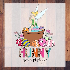 May include: A colorful graphic featuring a fairy sitting in a flower pot surrounded by Easter eggs and flowers. The text "HUNNY bunny" is displayed in a playful font with animal print and bright colors. The image has a whimsical, cartoon-like style.