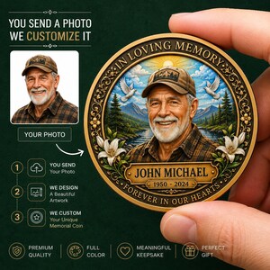 May include: A round memorial coin featuring a portrait of a man in a baseball cap, surrounded by a gold border with the text IN LOVING MEMORY, JOHN MICHAEL, 1950-2024, and FOREVER IN OUR HEARTS, decorated with white lilies, doves, and a mountain landscape.