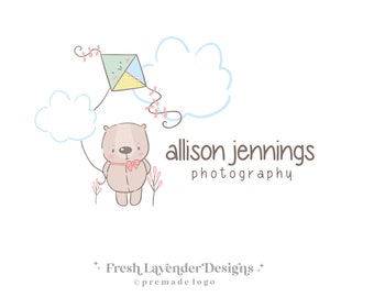 May include: A brown teddy bear with a pink bow holding a string attached to a blue, green, and yellow kite. The kite is flying in the sky with two white clouds. The text "allison jennings photography" is below the bear. The text "Fresh Lavender Designs" is at the bottom of the image.