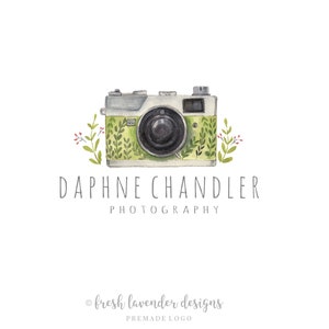 May include: A watercolor illustration of a vintage camera with green foliage and red flowers. The text "Daphne Chandler Photography" is below the camera. The text "fresh lavender designs" is at the bottom of the image.