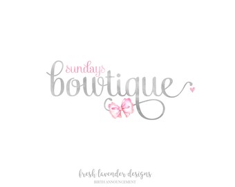 May include: A logo for a business called "Sundays Boutique" with the tagline "fresh lavender designs" and "BIRTH ANNOUNCEMENT". The logo is in a handwritten font with a pink bow and a small pink heart.