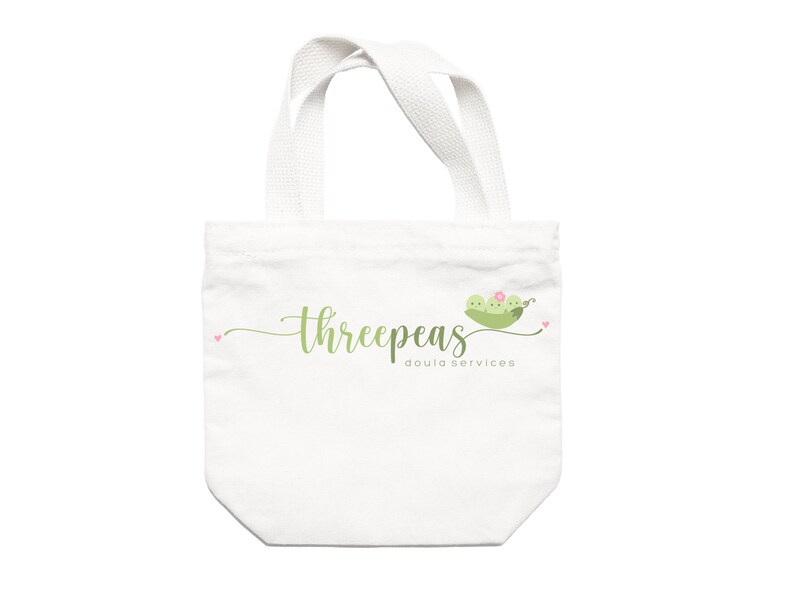 May include: White tote bag with green text that reads "threepeas doula services" and a green pea pod with three peas and a pink flower.