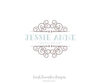 May include: A logo design for a photography business called "Jessie Anne Photography". The logo features a decorative, ornate design in brown with a light blue text box. The text "fresh lavender designs" is written in a cursive font below the logo.