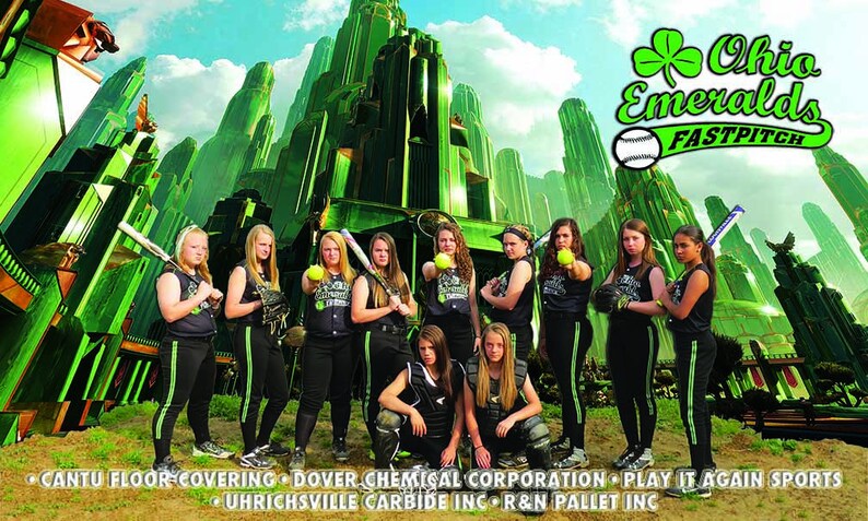 May include: A team of young women wearing black and green softball uniforms with the text "Ohio Emeralds FASTPITCH" on the front. The team is posed in front of a green and white backdrop that resembles the Emerald City from the Wizard of Oz.