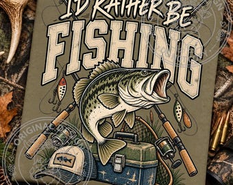 May include: An olive green t-shirt featuring a graphic illustration of a largemouth bass, two fishing rods, a tackle box, and a baseball cap. The text I'D RATHER BE FISHING is printed in large, bold, cream-colored letters across the center.