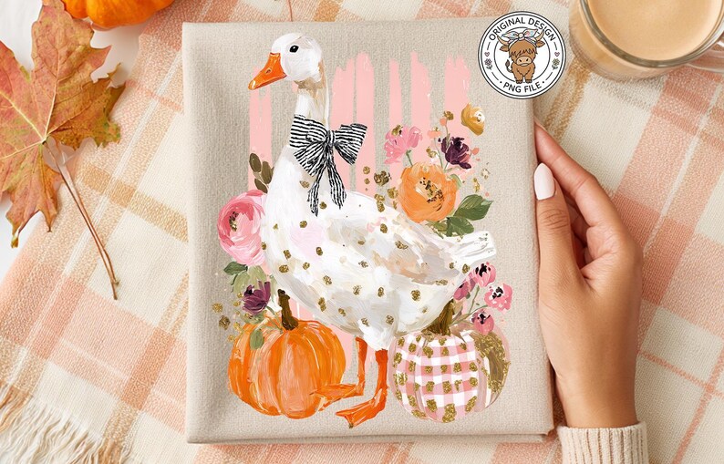 May include: A canvas print featuring a white goose with a black and white bow, surrounded by flowers and pumpkins. The goose has gold polka dots. The pumpkins are orange and pink. The background has pink stripes.