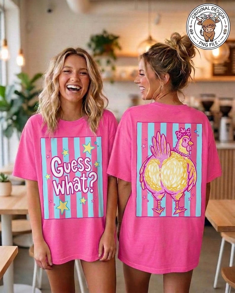 May include: Two women wearing matching pink t-shirts. The front of the shirt says "Guess What?" with stars. The back of the shirt features a cartoon chicken design with a pink bow and necklace, set against blue and pink stripes.