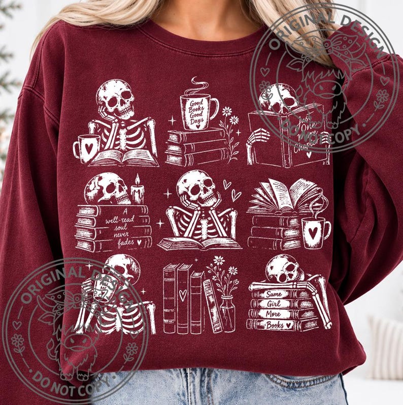 May include: A maroon crewneck sweatshirt featuring a white graphic print of nine distinct scenes with skeletons, stacks of books, mugs, and flowers. The text includes phrases like Good Books Good Days, A well-read soul never fades, and Same Girl More Books.