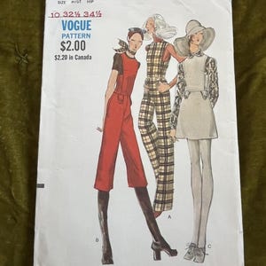 May include: Vintage Vogue pattern envelope featuring illustrations of three women in 1970s-style outfits. The envelope is white with text and the number 7877. The outfits include a jumpsuit, a plaid jumpsuit, and a dress. The price is $2.00.