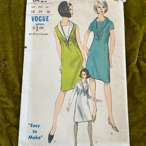 May include: Vintage Vogue pattern featuring illustrations of three dresses. The pattern includes sizes 14, 34, and 36. The text "Easy to Make" is displayed. The dresses are in green, blue, and white.