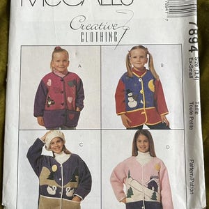 May include: McCall's Creative Clothing sewing pattern featuring four jacket designs for children. The jackets have various appliqued designs, including hearts, a snowman, swans, and a house with trees. The pattern size is Ex-Small.