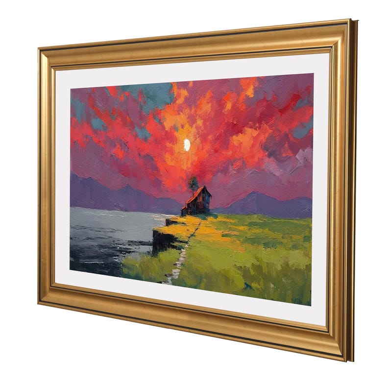 May include: A framed landscape painting shows a sunset over a lake and a small house on a cliff. The sky is filled with vibrant red and orange hues, with a bright moon. The painting is in a gold frame.