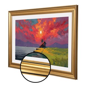 May include: A framed landscape painting depicting a sunset over a waterside house. The artwork features a colourful sky with shades of red, orange, and purple. The frame is gold.