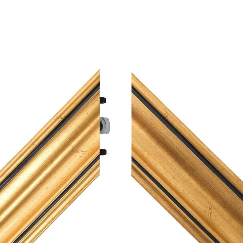 May include: Two sections of a gold picture frame with a black inner edge. The frame features a decorative, ridged design. A silver bolt and black fasteners are visible on the frame's edge, suggesting assembly or joining.