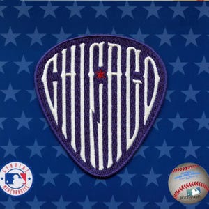 May include: A purple and white patch with the word "CHICAGO" in a stylized font. The patch has a red star and is on a blue background with white stars. A baseball with the MLB logo is in the lower right corner.