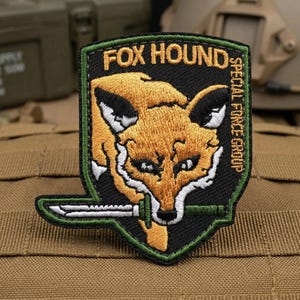 May include: A set of three ceramic mugs with a speckled, matte finish. The mugs are in shades of cream, light gray, and dark gray. Each mug has a simple, minimalist design, perfect for coffee or tea.