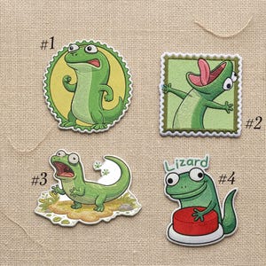 May include: A white ceramic mug with a black handle and the text "But First, Coffee" in a black, handwritten-style font. The mug is on a white surface.