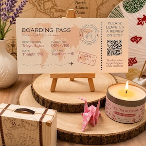 May include: A rectangular boarding pass card with a world map background, featuring the text Boarding Pass, Date Night Airlines, Destination Tokyo, Japan, Flight No. DDN-JP01, Date Tonight, and Seat No. Together, with a QR code and a small airplane icon.