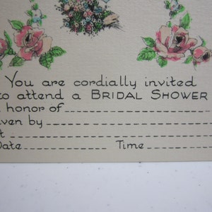 May include: A vintage bridal shower invitation card with a floral design. The card has a blank space for the bride's name, the host's name, the date, and the time of the shower.