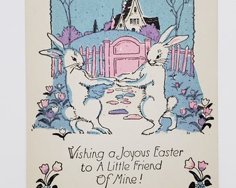 Darling unused 1920's-30's hand colored Easter greeting card 2 rabbits dancing in tulip lined path in front of pink gated fence and cottage