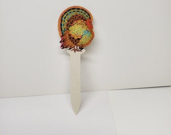 Vintage unused NOS 1920's Hallmark die cut gold gilded Thanksgiving fall themed colorful decorative turkey pick to decorate cakes ices