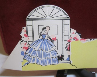 Art deco 1930's unused die cut Gibson place card southern belle type holding basket of flowers with black scottie on front porch