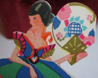 Art deco 1920's colorful gold gilded die cut unused P.F. Volland bridge tally card pretty lady in deco dress holds deco hand fan