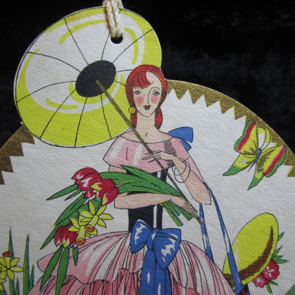 1930's  Art Deco Die Cut  gorgeous bridge tally card with red head in a garden holding flowers and parasol  gold gilded hallmark