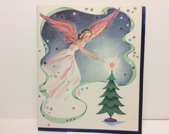 Gorgeous 1940&#39;s unused Whitman Christmas card pretty angel or fairy in pink w/ pink wings puts pink star on tree top with her wand